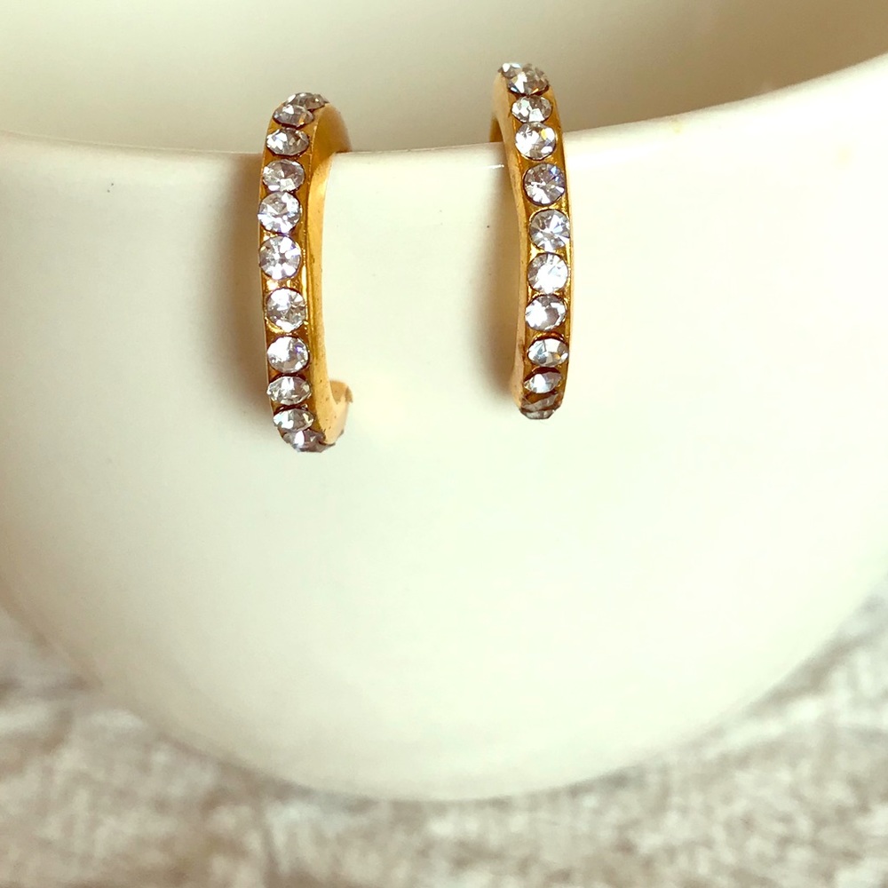 Gold tone and crystal earrings.